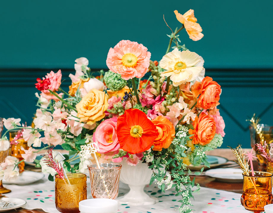 colorful floral arrangement on a dinner party table