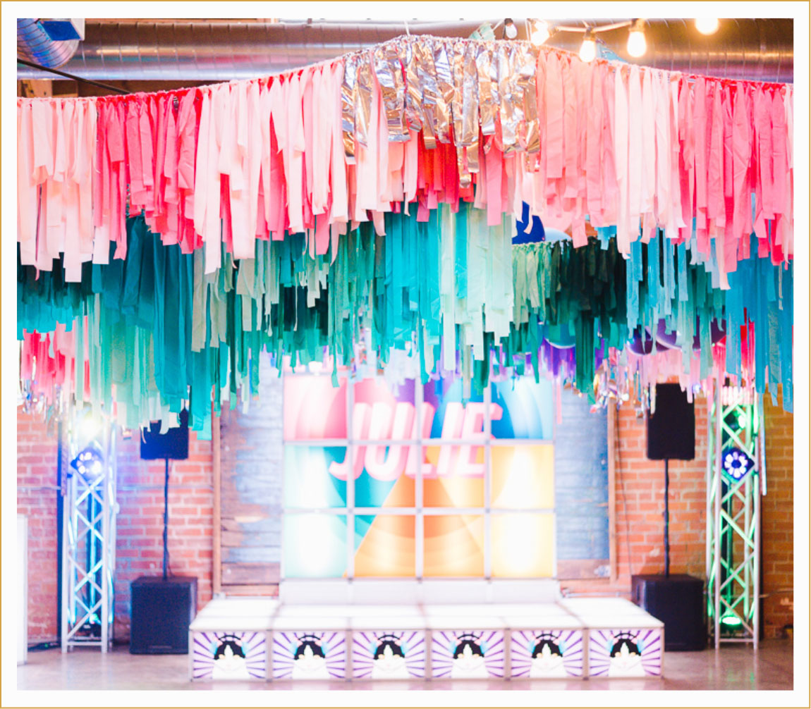 colorful stage setup for a color themed bat mitzvah celebration
