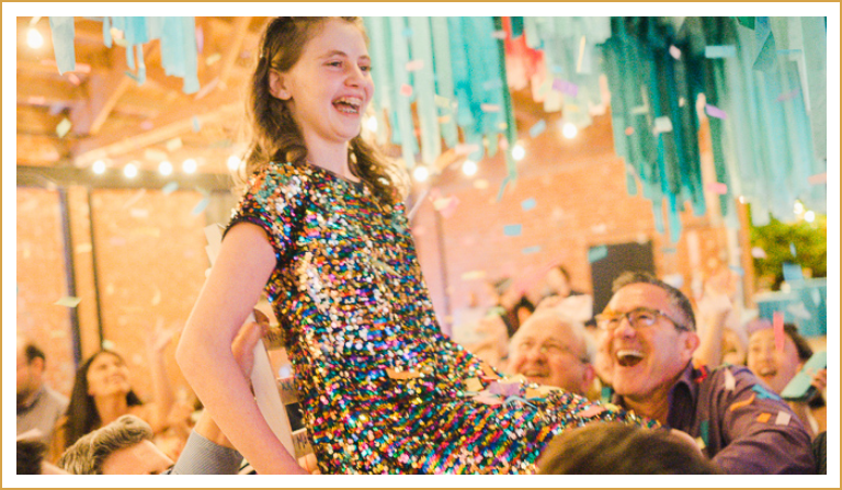 girl in sparkly dress celebrating her bat mitzvah